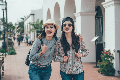Canvas Print two asian girl tourist smiling walking on street shopping while travel in santa barbara america