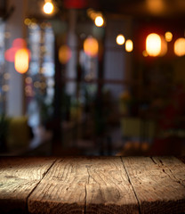 blurred background of bar and dark brown desk space of retro wood