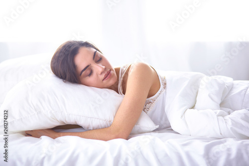 beautiful young woman basking in bed in the morning. Beautiful 