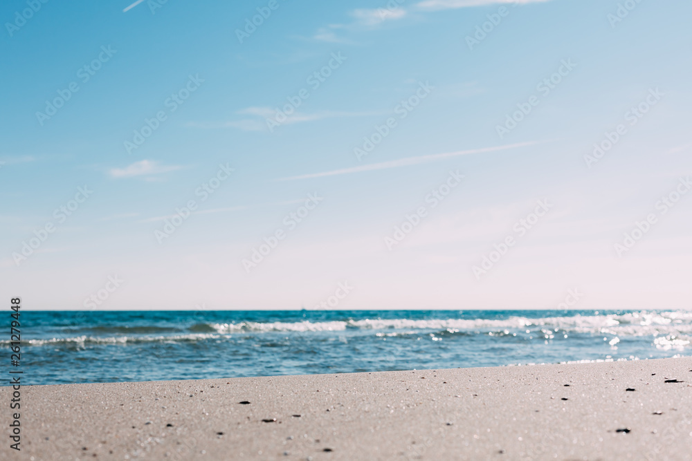 Fototapeta premium Summer sand beach and seashore waves background