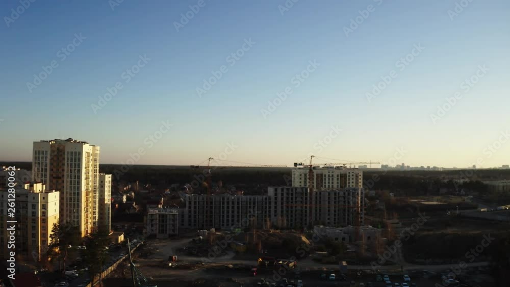 Aerial sidewards dolly, showing a construction site in the Chaiki area of Kiev during sunset. Aerial sidewards dolly, showing a construction site in the Chaiki area of Kiev during sunset.