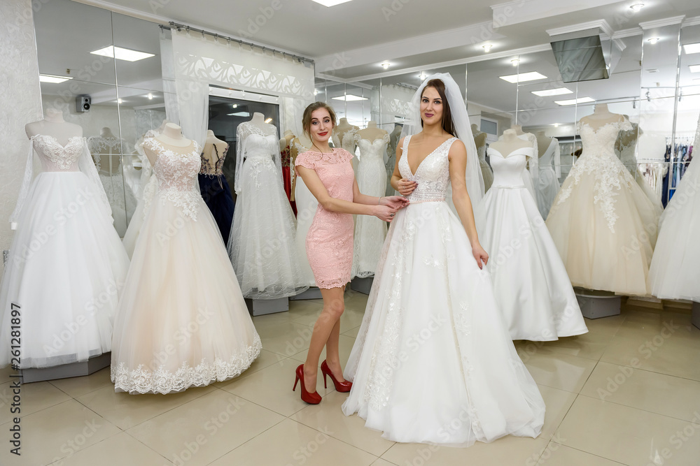 Young and beautiful bride posing in wedding dress Young and beautiful bride posing in wedding dress