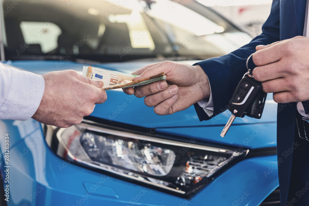 Male hand giving euro banknotes for dealer close up