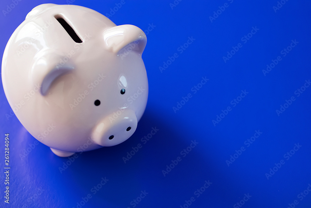 Pink piggy bank on bright blue background. Pink piggy bank on bright blue background.