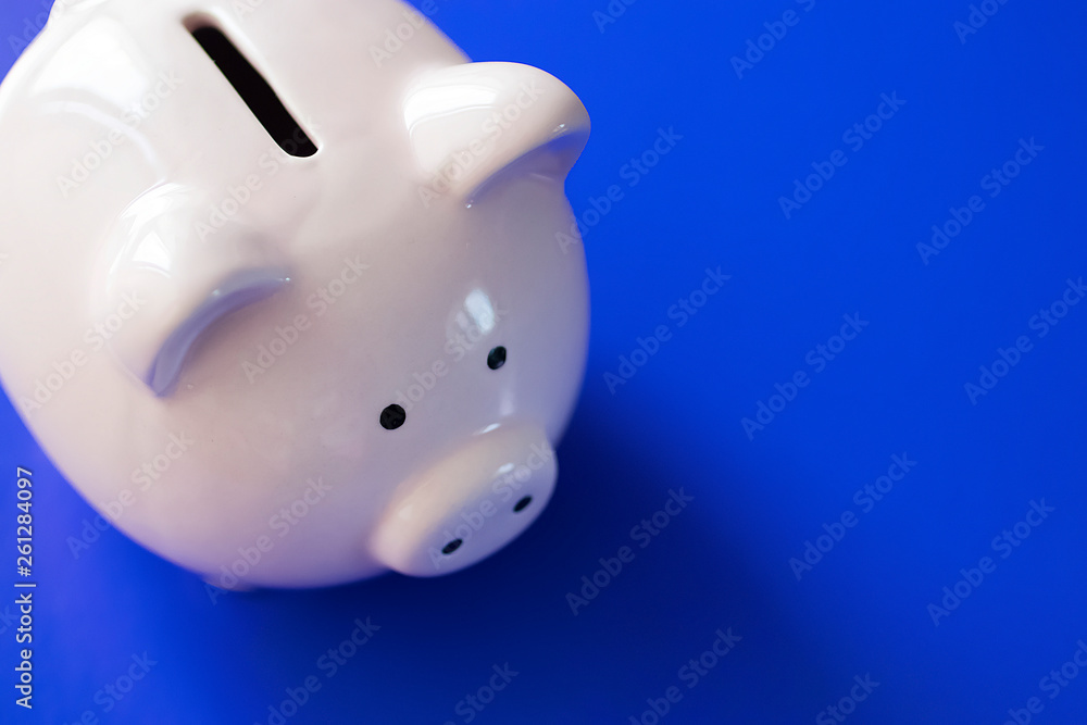 Pink piggy bank on bright blue background. Pink piggy bank on bright blue background.