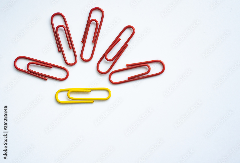 Obraz premium colored clips scattered on white background, form some pattern