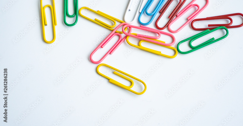 colored clips scattered randomly on white background colored clips scattered randomly on white background