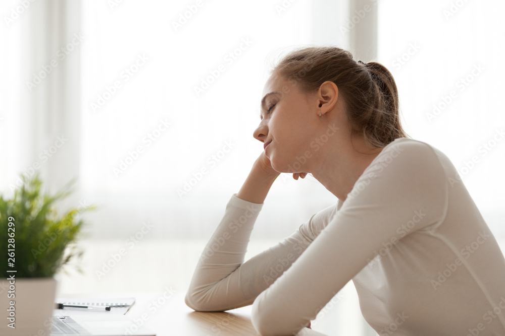 Tired exhausted woman sitting at desk falling asleep, working too long Tired exhausted woman sitting at desk falling asleep, working too long