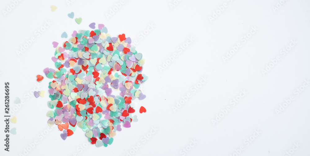 colored Sequin scattered on white background
