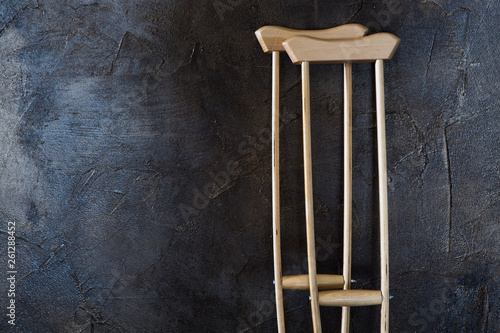 wooden crutches on the  grungy wall. photo