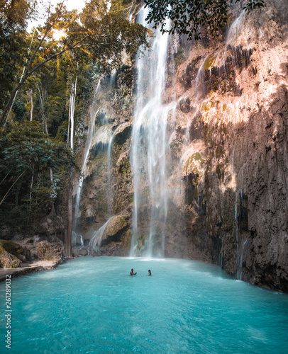 Amazing secret waterfall with blue turquoise water. Tumalog, Kawasan Philippines Cebu Island.