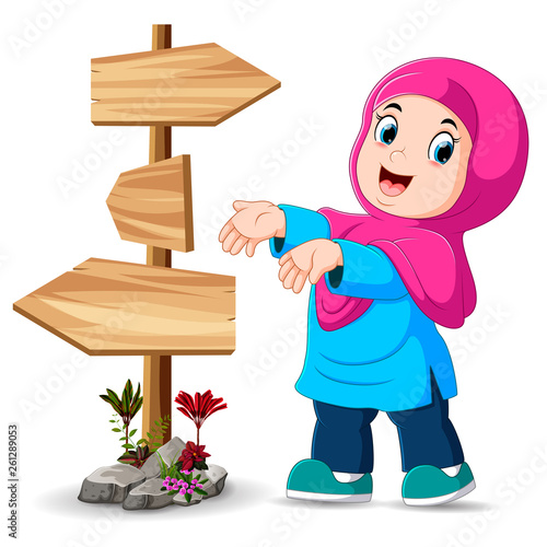 the girl is standing beside the signpost and show the right way