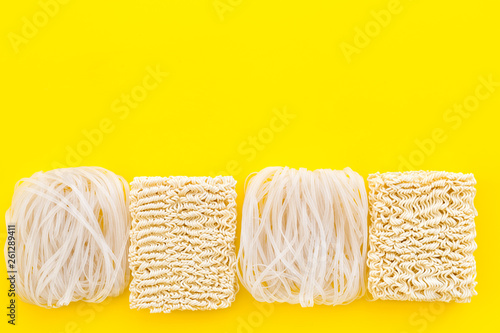 Geometric design with Chinese, Japanese products, noodles, rice vermicelli on yellow background top view mock up photo