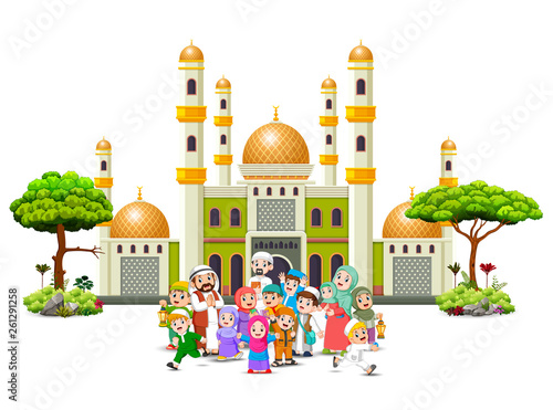 A happy big family are gathering infornt of the green mosque