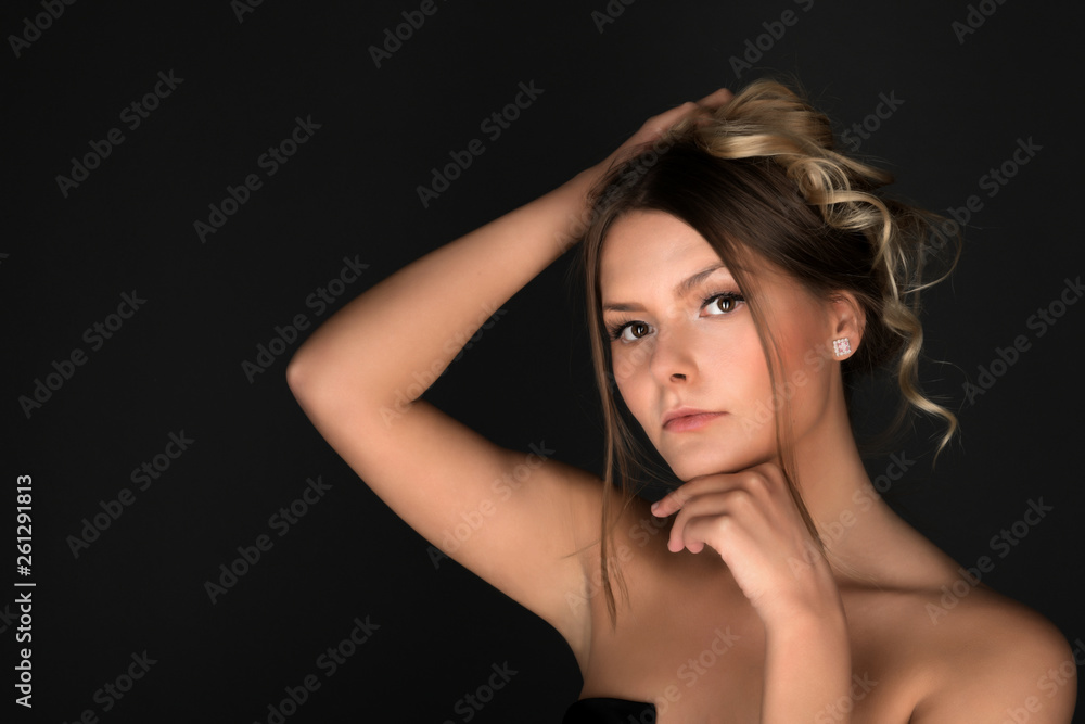 Beautiful smiling woman with clean skin, natural make-up, and white teeth on grey background Beautiful smiling woman with clean skin, natural make-up, and white teeth on grey background