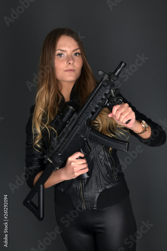 Wallpaper Mural Woman holding gun  Torontodigital.ca