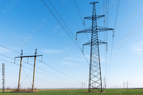 Wallpaper Mural High voltage lines and power pylons and a green agricultural landscape on a sunny day. Torontodigital.ca