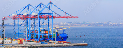 Container Ship is loading in a sea port  Odessa. Work of the container terminal for shipping goods.