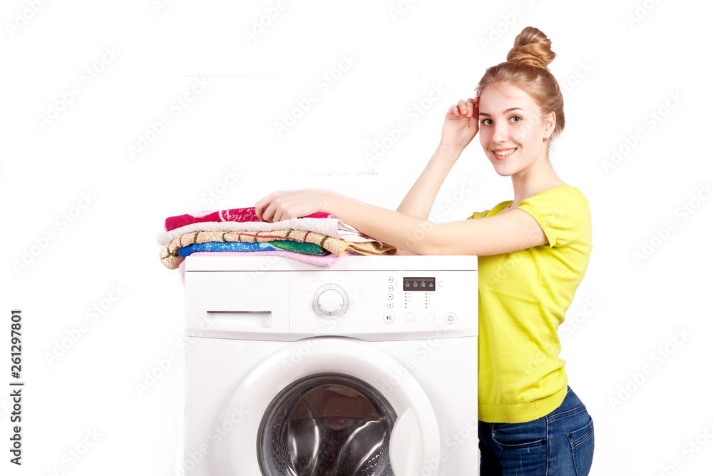Beautiful happy girl and washing machine isolated on white background Beautiful happy girl and washing machine isolated on white background