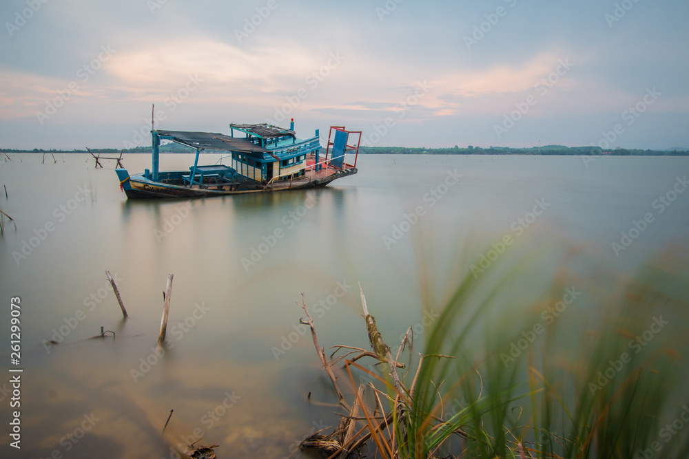 Fototapeta premium Long exposure, Decayed ship in the sea