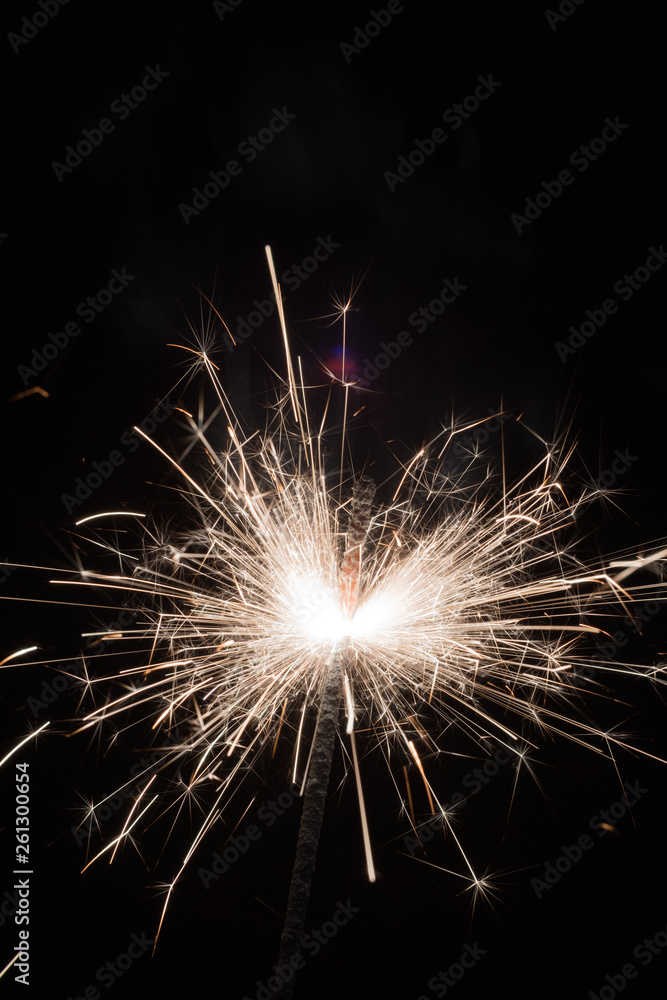 Fototapeta premium Bright sparks of Bengal fire on a black background.