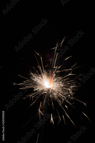 Bright sparks of Bengal fire on a black background.