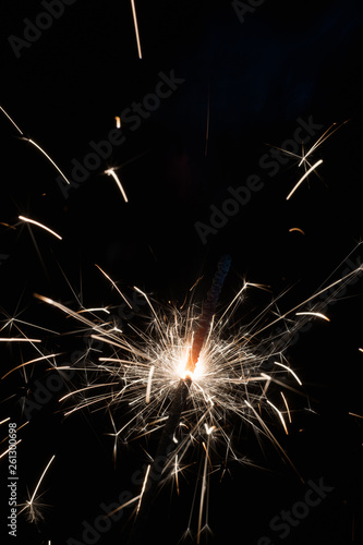 Wallpaper Mural Bright sparks of Bengal fire on a black background. Torontodigital.ca