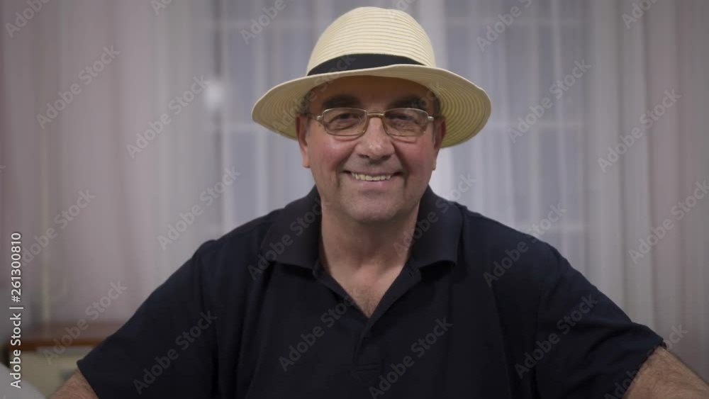 portrait of smiling senior man in hat portrait of smiling senior man in hat