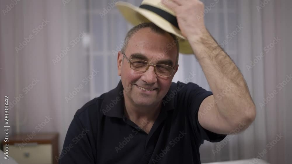 portrait of smiling senior man in hat portrait of smiling senior man in hat