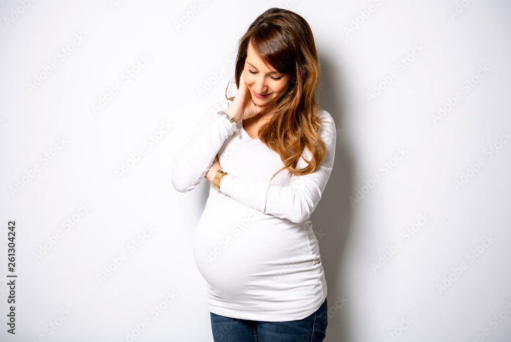 A Portrait of adorable pregnant woman in white A Portrait of adorable pregnant woman in white
