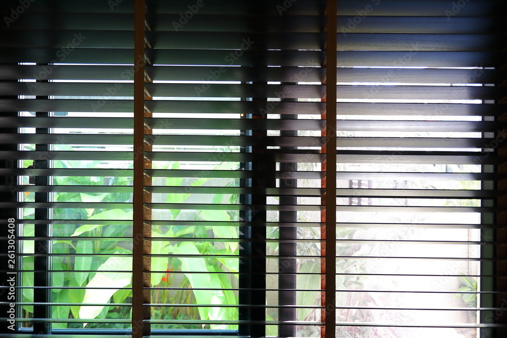 Fototapeta brown blind shade and mosquito wire screen on window, interior design decoration in home office