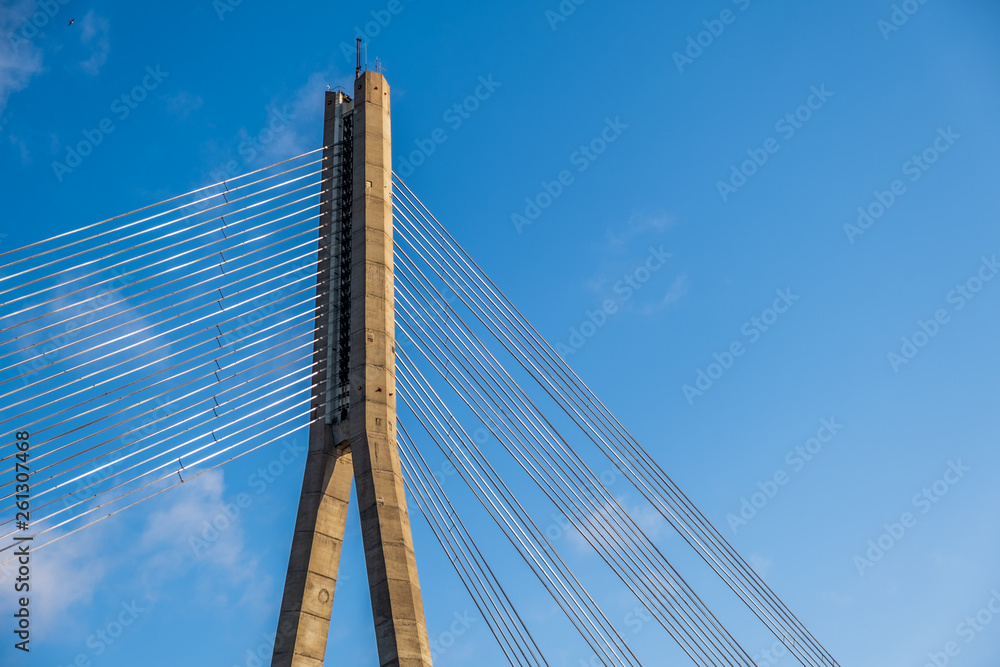 Riga,Latvia-April 12 2019: Vansu bridge in Riga,Latvia with blue sky Riga,Latvia-April 12 2019: Vansu bridge in Riga,Latvia with blue sky