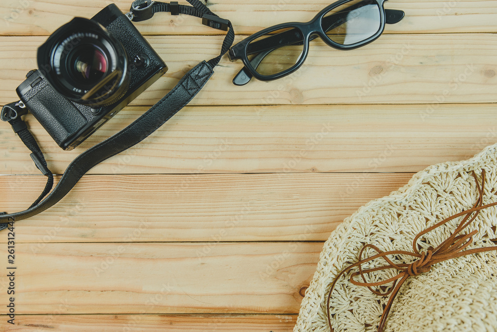 top view of travel accessories on wooden background top view of travel accessories on wooden background