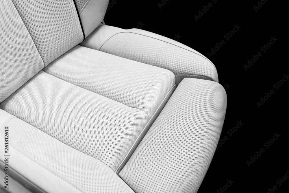 White leather interior of the luxury modern car. Perforated white