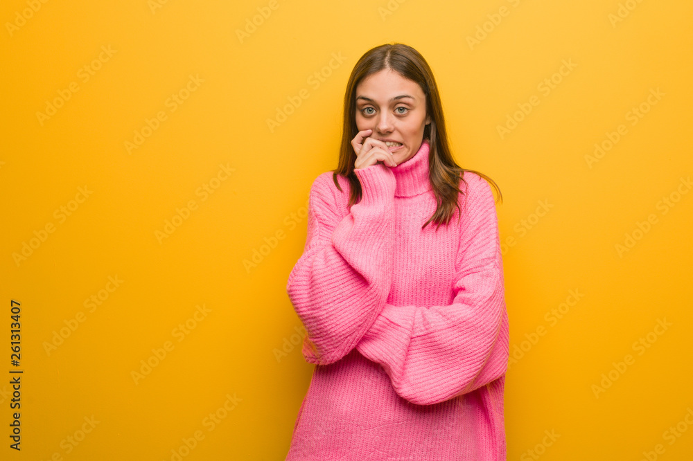 Young modern woman biting nails, nervous and very anxious Young modern woman biting nails, nervous and very anxious
