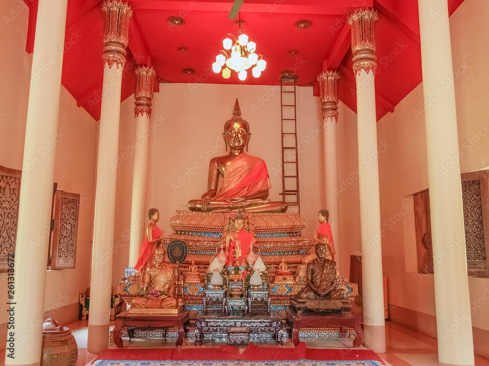 Seated bronze buddha on base in buddhist temple, Wat Pho Banlang, Ban Pong District, Ratchaburi, Thailand.