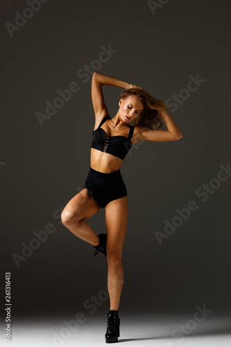 Elegant female dancing striptease dance