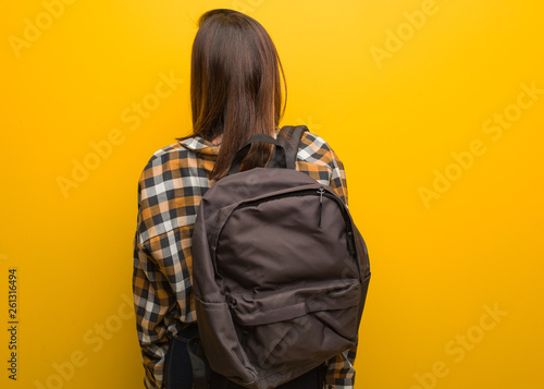 Photos Young student woman from behind, looking back