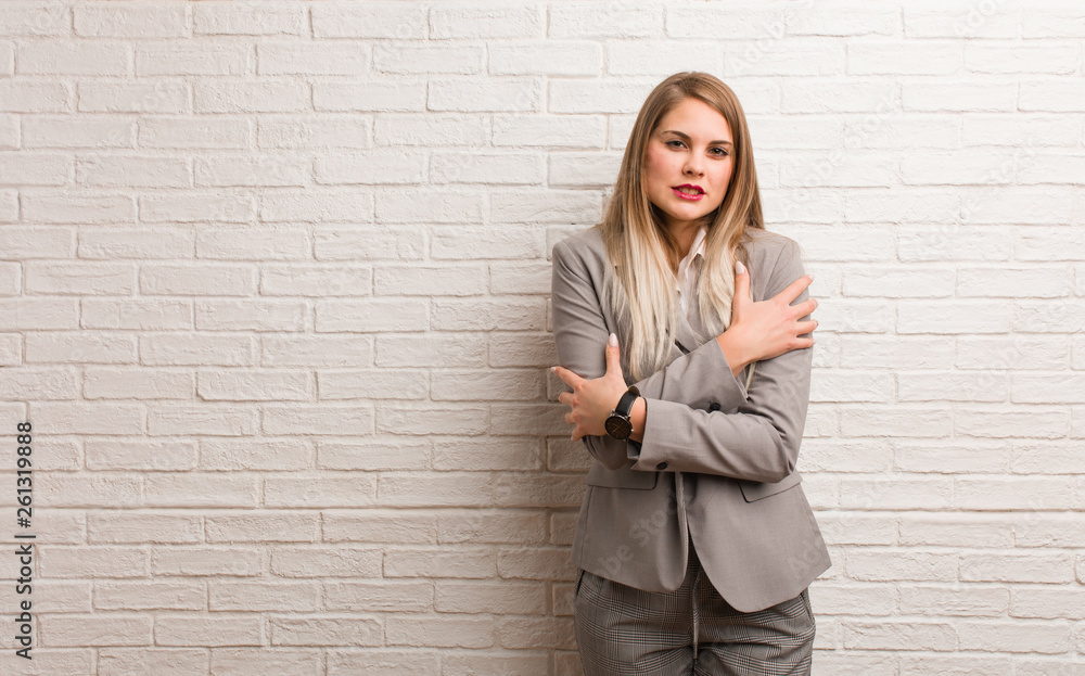 Young russian business woman going cold due to low temperature Young russian business woman going cold due to low temperature