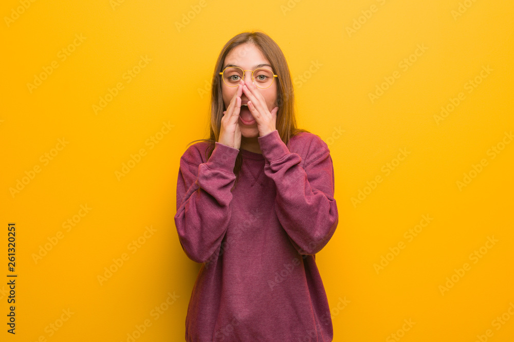 Young casual woman shouting something happy to the front Young casual woman shouting something happy to the front