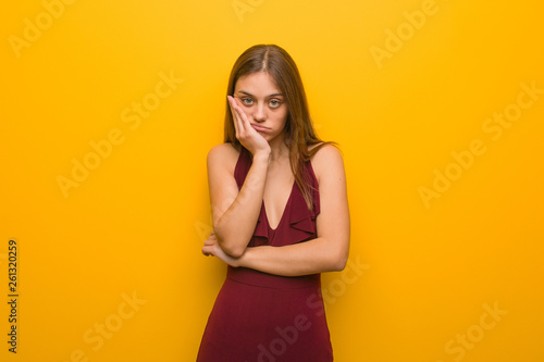 Young elegant woman wearing a dress tired and very sleepy