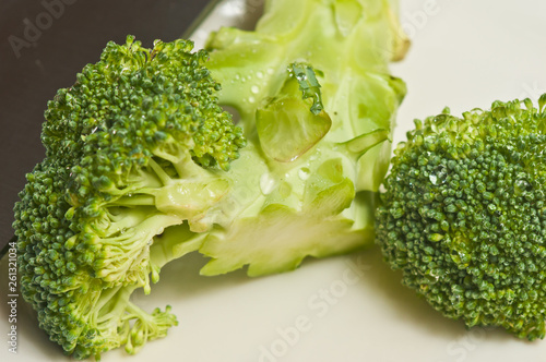 Front view, closeup of raw, freshly picked broccoli spears,  photo