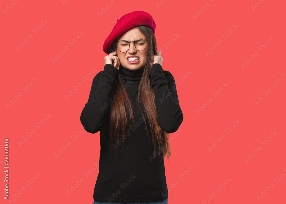 Young artist woman covering ears with hands Young artist woman covering ears with hands