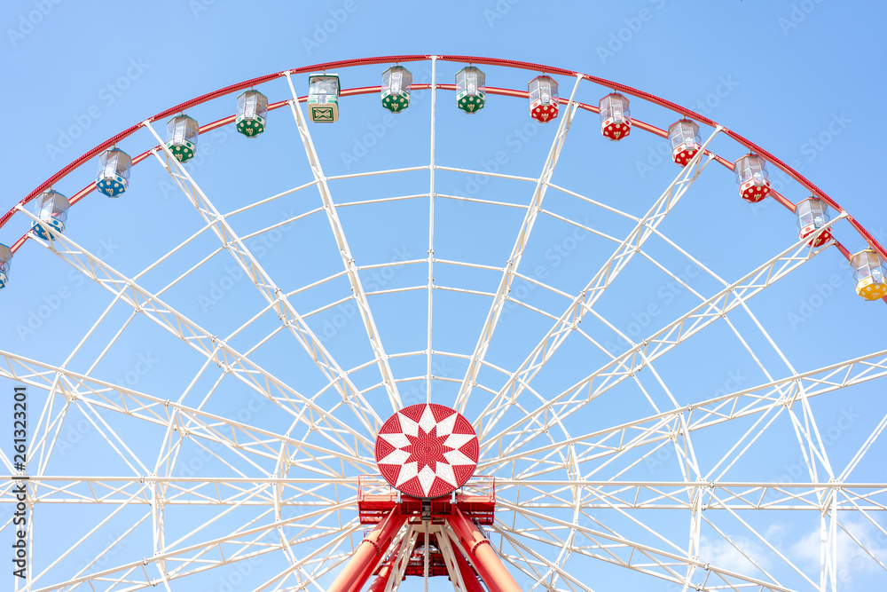 ferris wheel on a background of bright blue sky