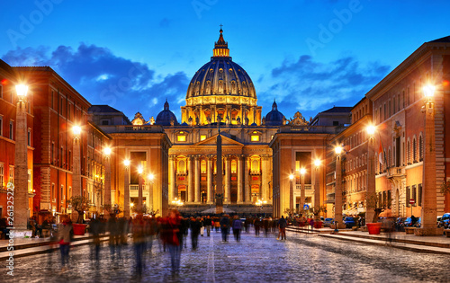 Vatican City Holy( See). Dome of St. Peters Basil cathedral at Saint Peters Square. Evening sunset, blue hour with night sky and street lamps. Rome, Italy. © Yasonya