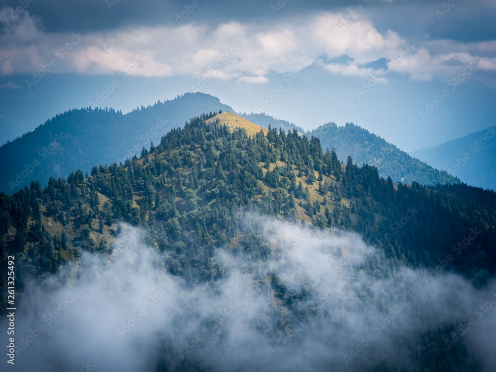 Mountains peaks in cloudy and foggy environments Mountains peaks in cloudy and foggy environments