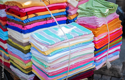  Towels sale at the market Rows of colorful hand towel.