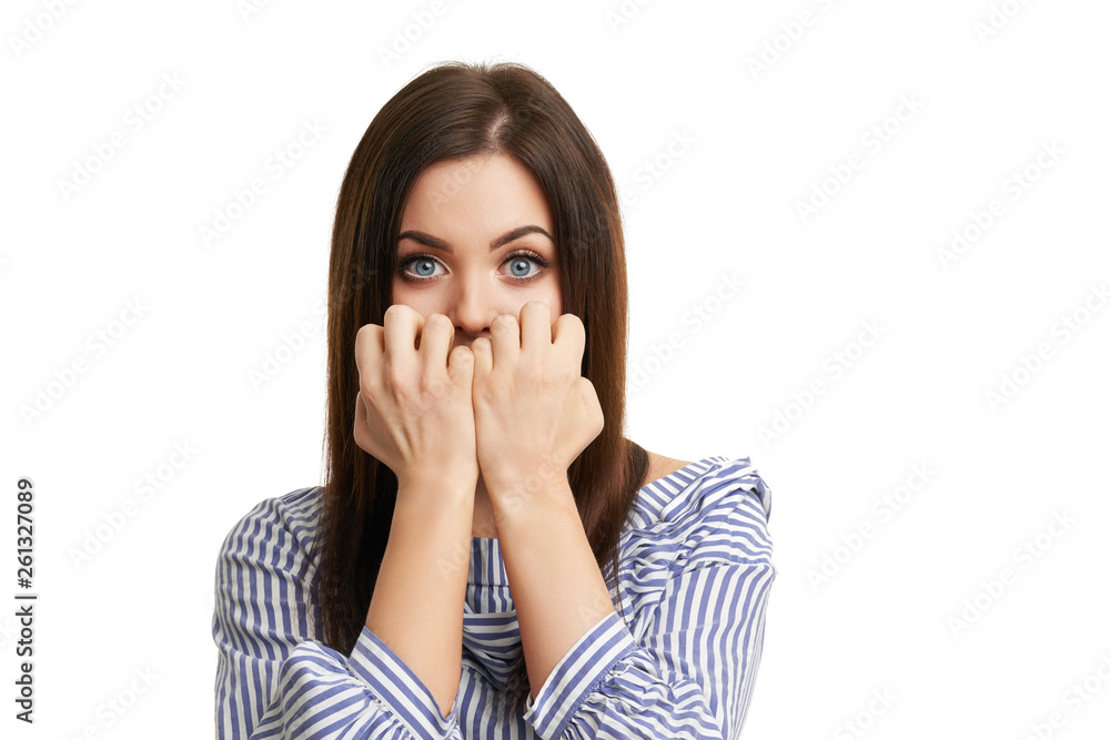 Shocked girl covers her face with hands isolated on white Shocked girl covers her face with hands isolated on white