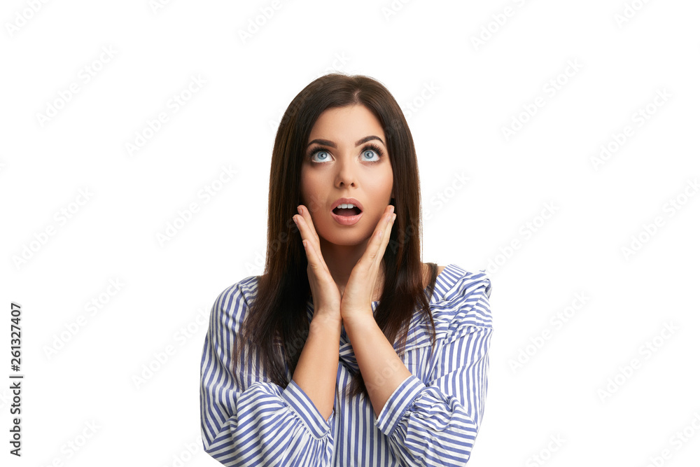 Shocked girl covers her face with hands isolated on white Shocked girl covers her face with hands isolated on white