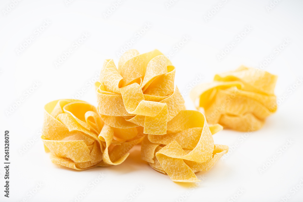Raw pasta on white surface Raw pasta on white surface